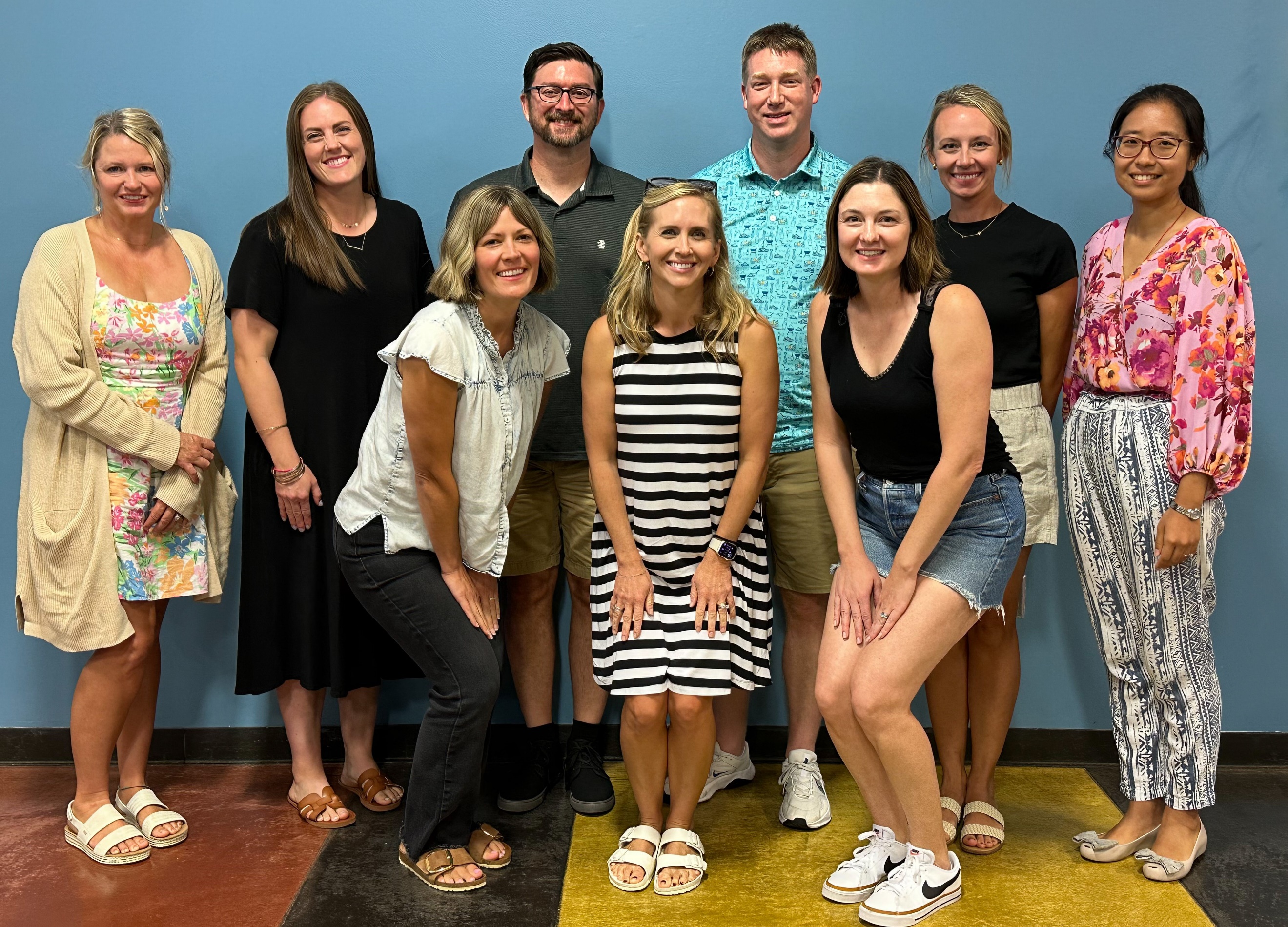 A group of people posing for a photoDescription automatically generated